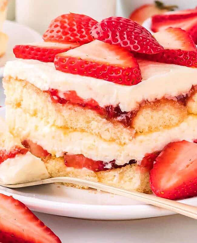 Strawberry Tiramisu on a plate with a fork.