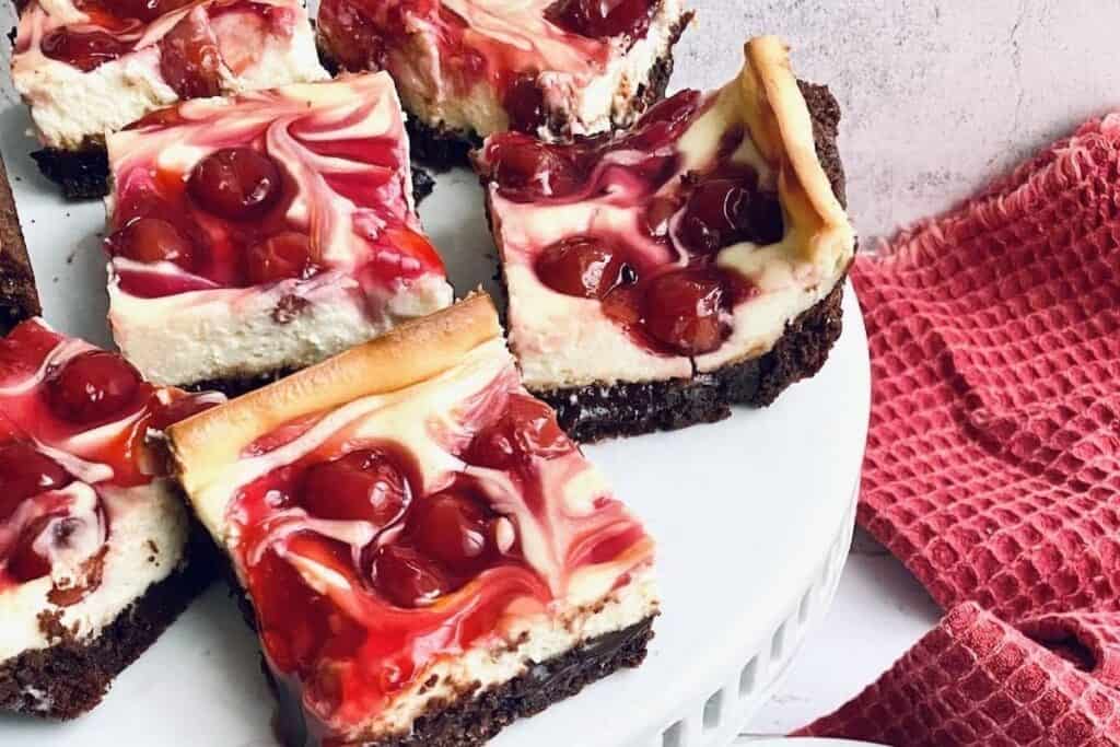 A platter of Cherry Cheesecake Brownies topped with cherries