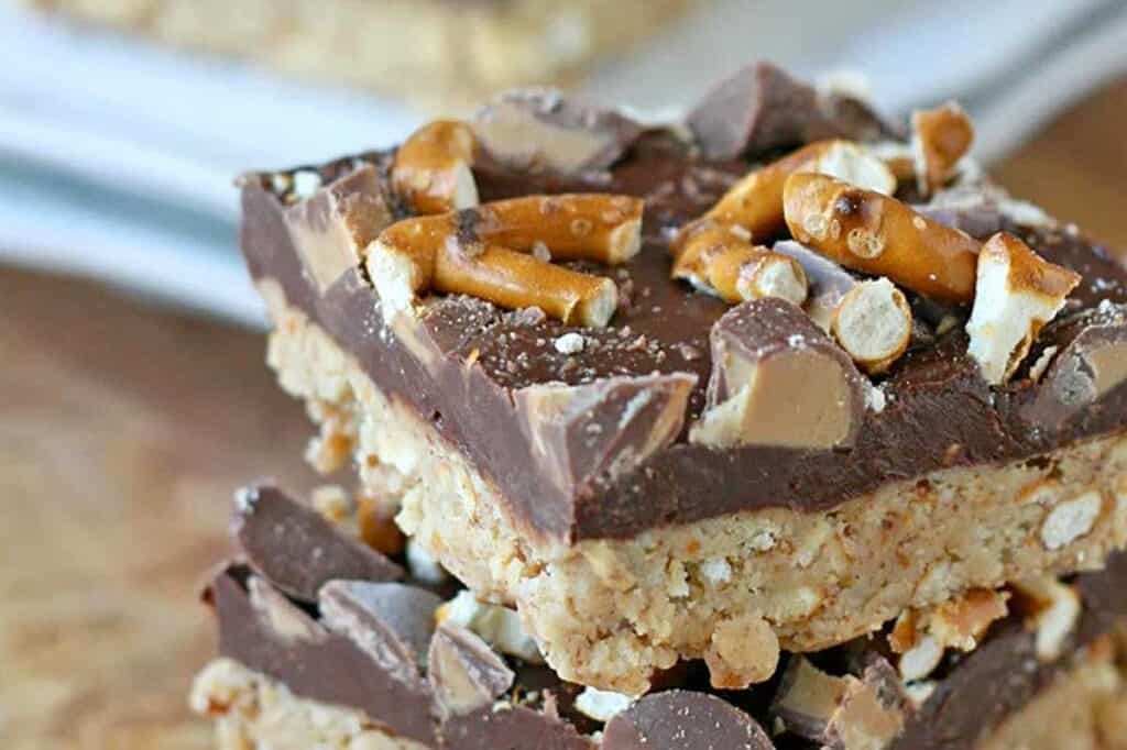 A stack of Peanut Butter Pretzel Bars on a plate.