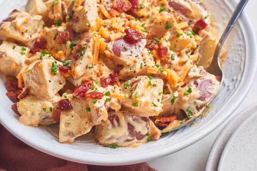 A big bowl of Baked Potato Salad ready to serve.