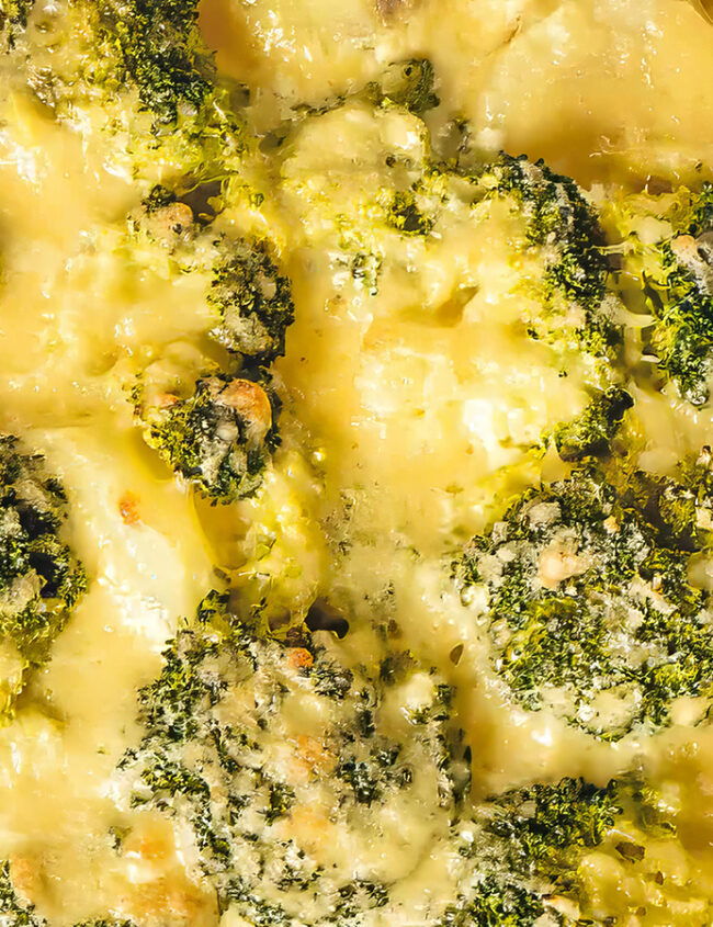 A close up image of a pan full of Broccoli Cauliflower Casserole.