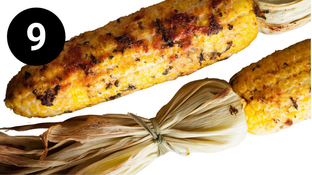 Grilled corn on the cob with husks tied.