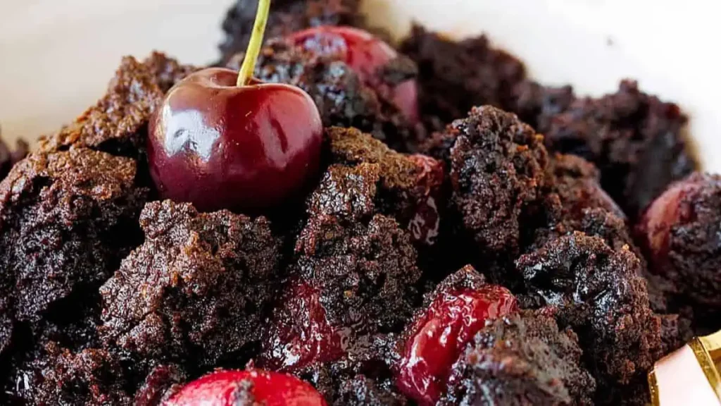 A very close up image of Chocolate Cherry Dump Cake in a bowl.