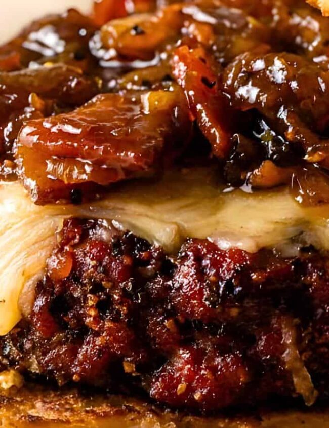 A close up image of a Smokehouse Burgers with Bacon Onion Jam..