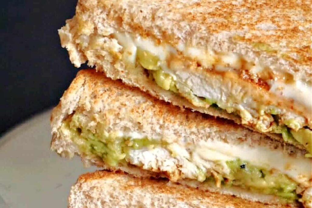 A close up image of a Grilled Chicken Avocado Sandwich.