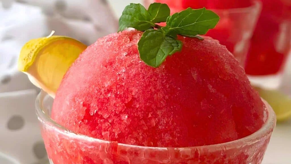 Watermelon Lime Sorbet topped with mint leaves.