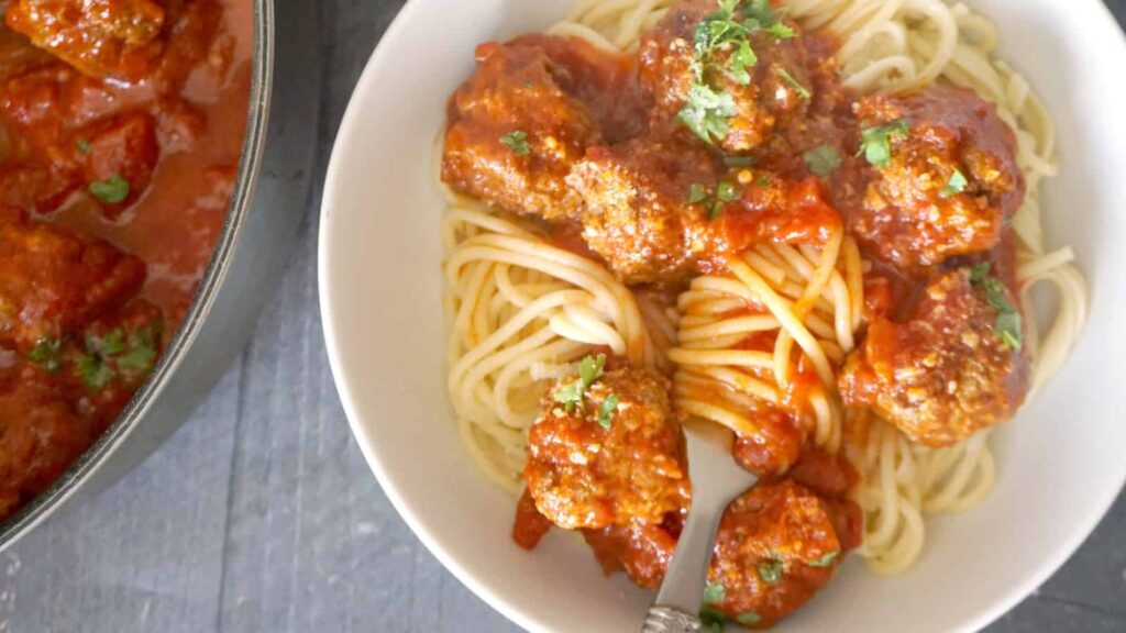 Meatballs in Tomato Sauce in a bowl with a fork.