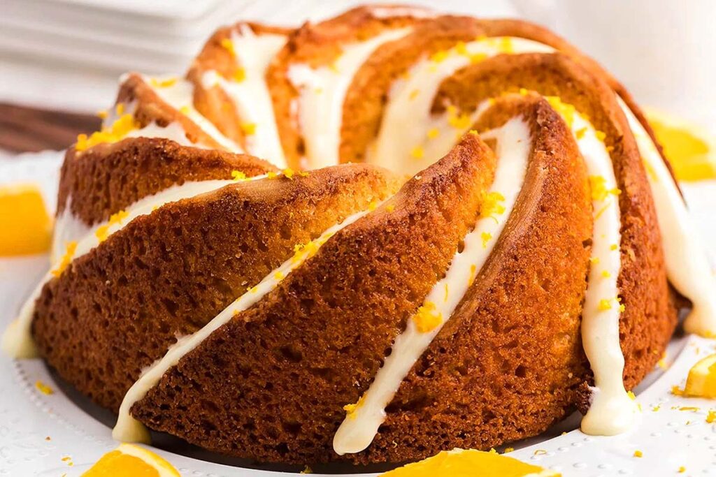 Orange Bundt Cake on a platter.