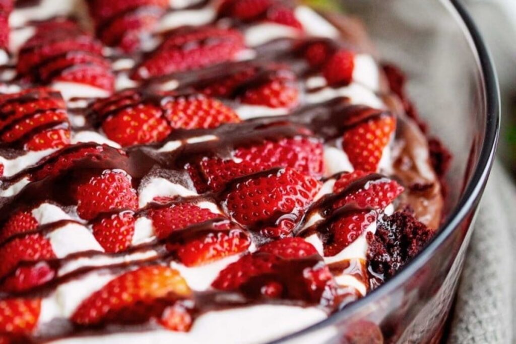 Chocolate Strawberry Trifle topped with fresh strawberries and drizzled with chocolate.