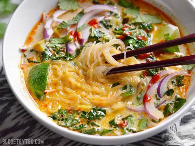 Thai Curry Vegetable Soup with noodles in a bowl.