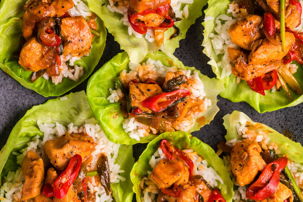 Spicy Gochujang Chicken Stir Fry served in lettuce bowls.