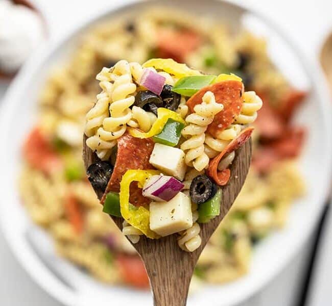 A close up image of a spoonful of Pizza Pasta Salad.