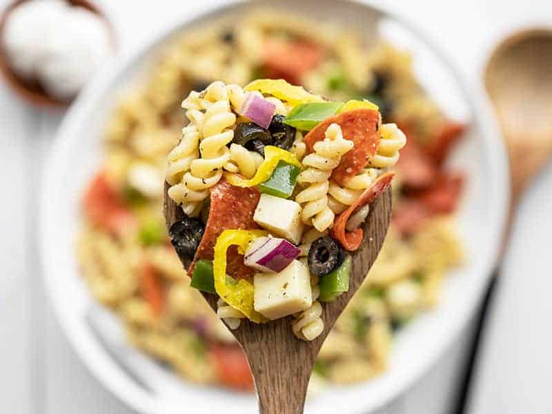 A close up image of a spoonful of Pizza Pasta Salad.