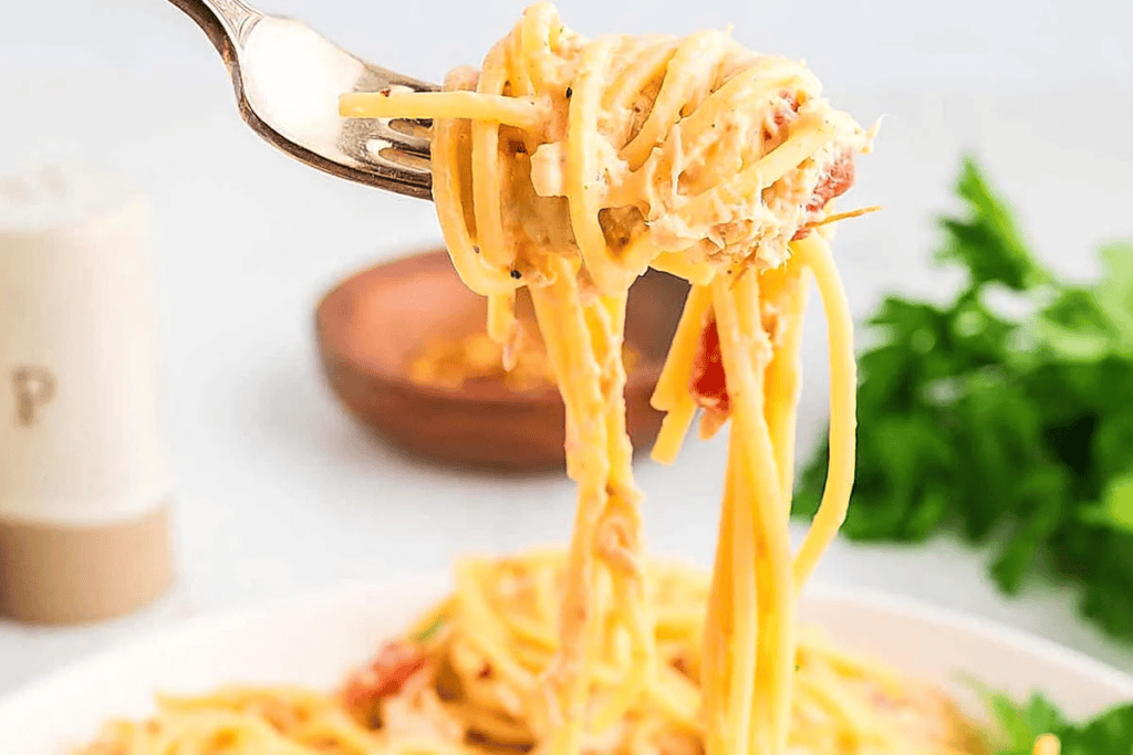 Crockpot Chicken Spaghetti twirled onto a fork.