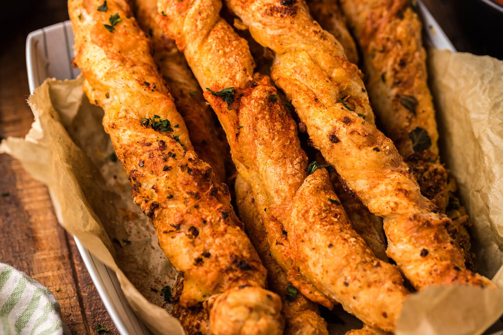 A platter of freshly baked Puff Pastry Garlic Cheese Twists. 