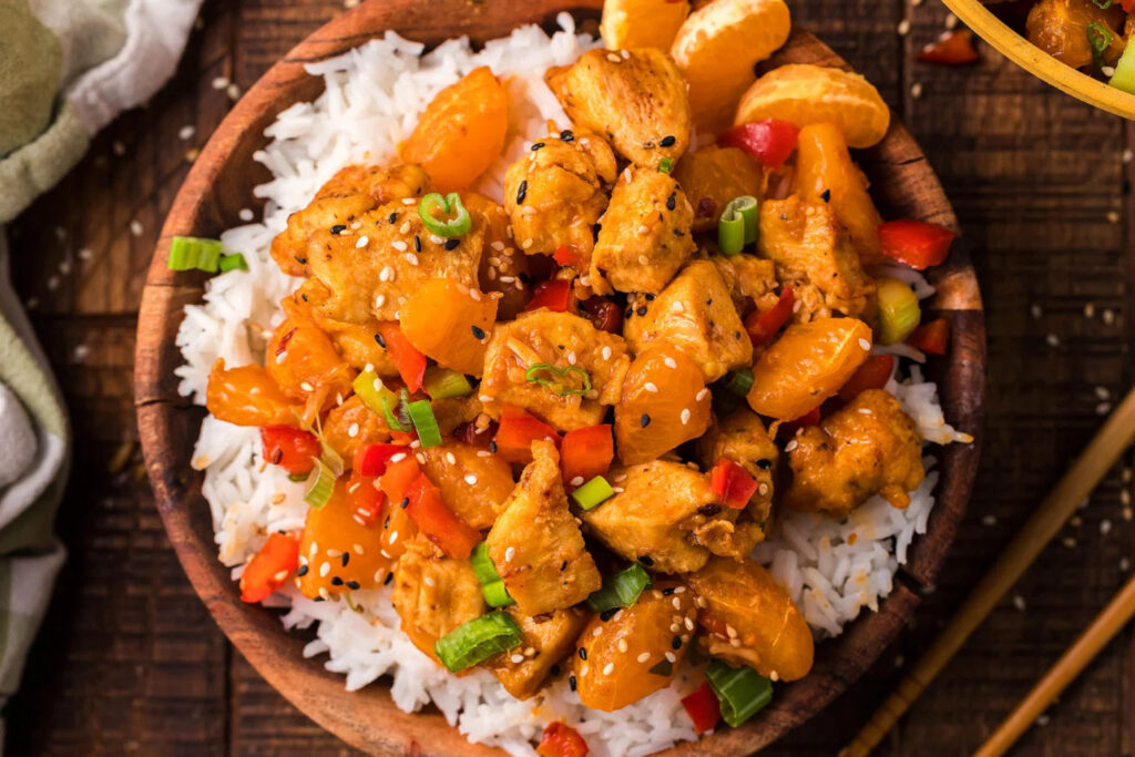 A bowl full of Tasty Chicken Stir Fry served on rice.