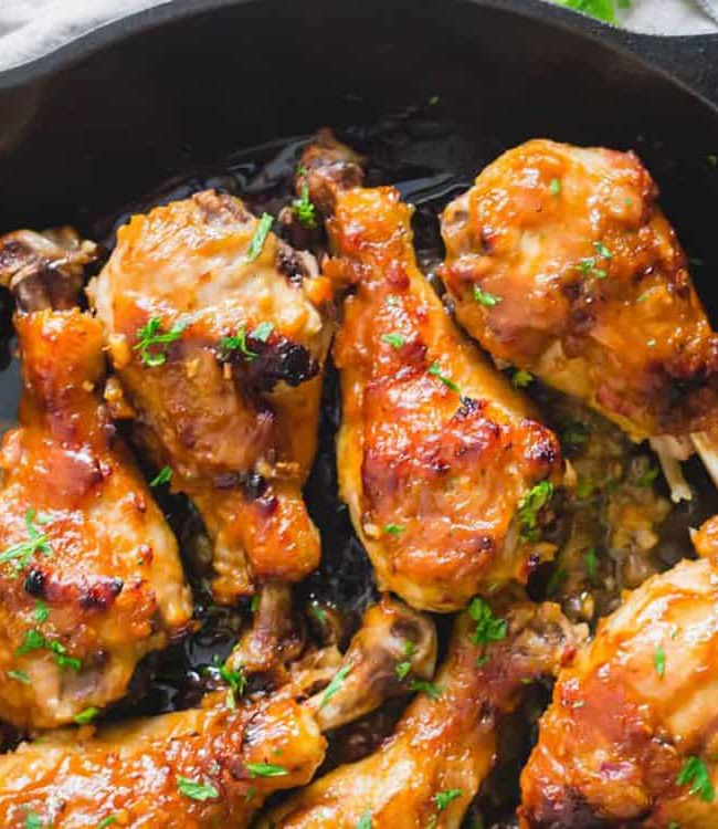 A pan of Maple Miso Chicken garnished with green onions.