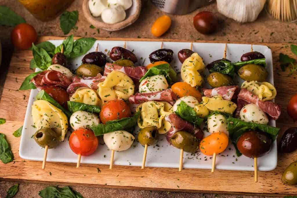 Antipasto Skewers on a white platter ready to serve.