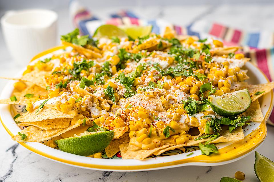 Street Corn Nachos piled high on a plate.