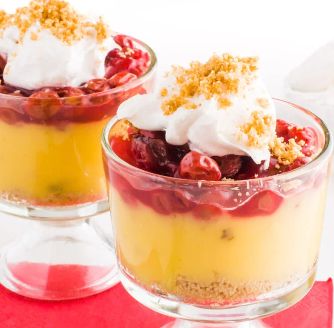 Two glasses of layered Vegan Cherry Vanilla Parfaits.