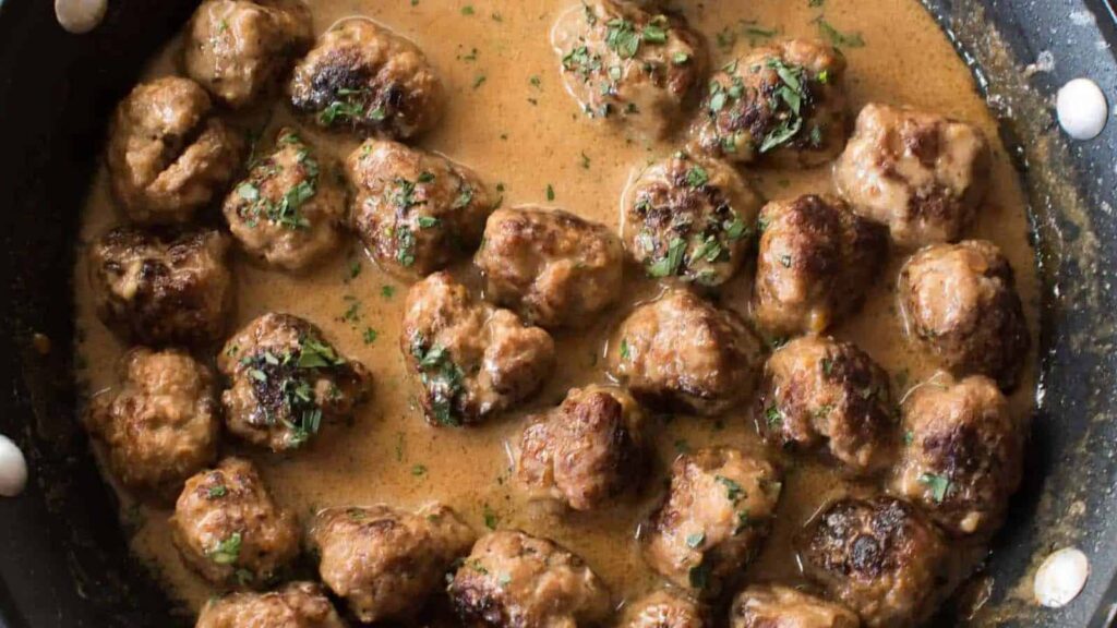 A pan of Swedish Meatballs with gravy.