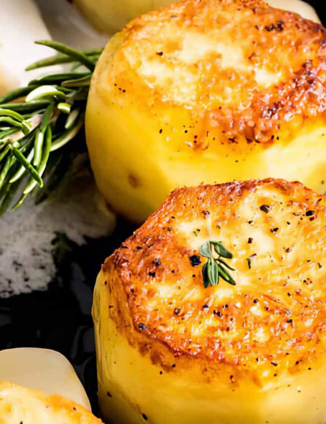 Fondant potatoes in a pan with butter