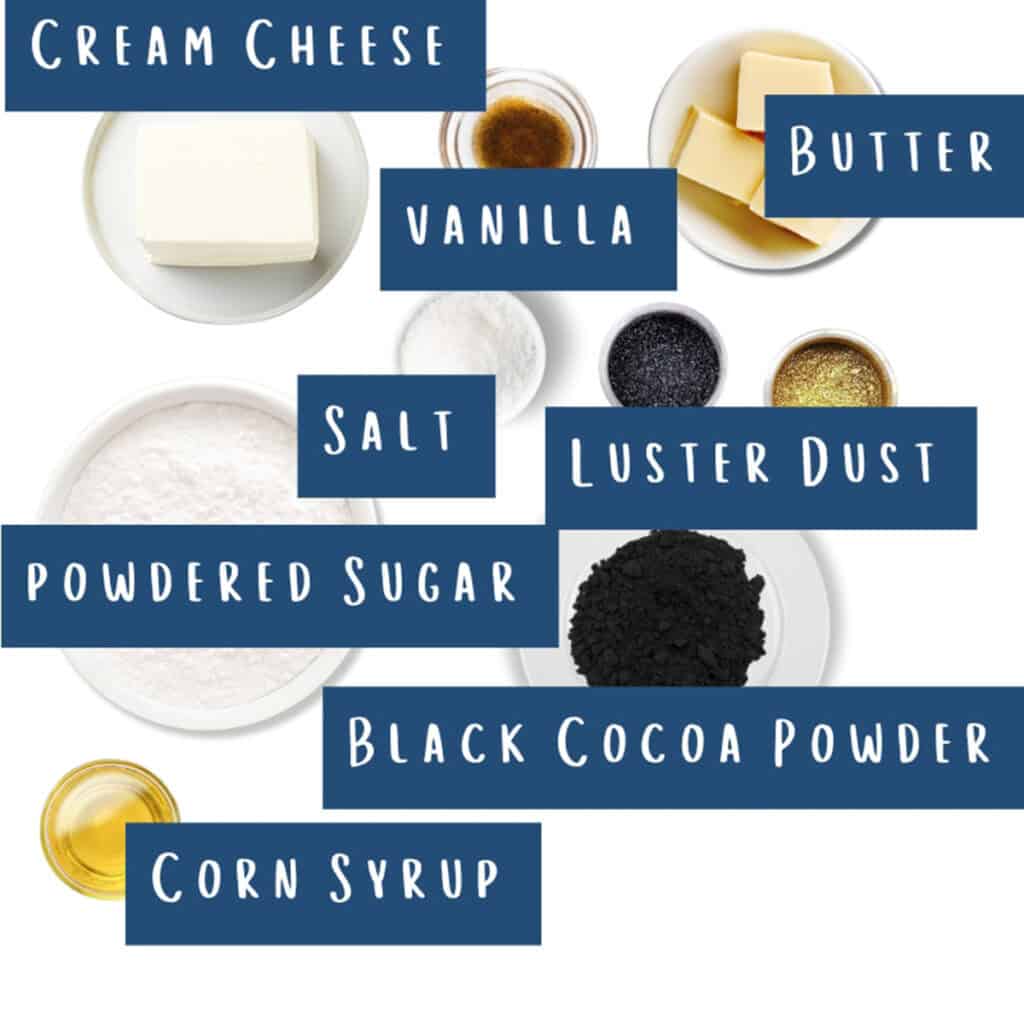 An arrangement of labeled baking ingredients: cream cheese, vanilla, butter, salt, luster dust, powdered sugar, black cocoa powder, and corn syrup. Each is in separate bowls or containers on a white background.