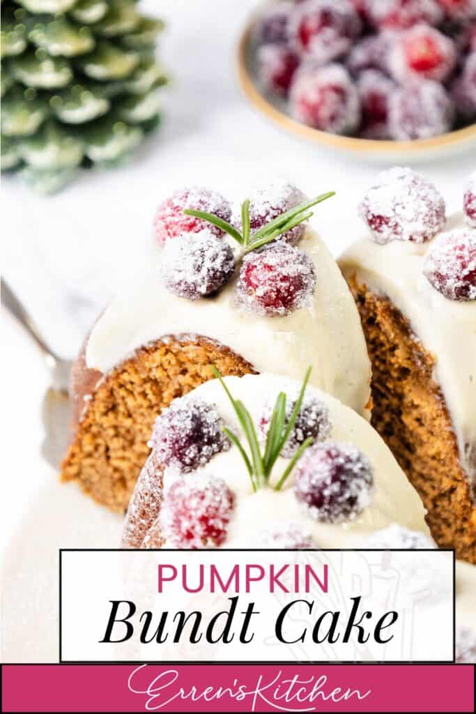 A gingerbread-spiced pumpkin bundt cake topped with white icing and sugared berries, garnished with rosemary sprigs. In the background, more sugared berries sit in a bowl next to a small pine tree decoration. Text on the image reads "Pumpkin Bundt Cake - Erren's Kitchen.