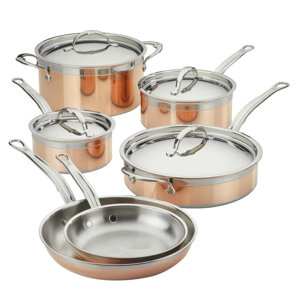 Discover the Hestan CopperBond Cookware, a stunning set of copper and stainless steel pots and pans with silver handles. Featuring five versatile saucepans and frying pans with lids, all neatly arranged against a white background—get it now for the best time in your kitchen!