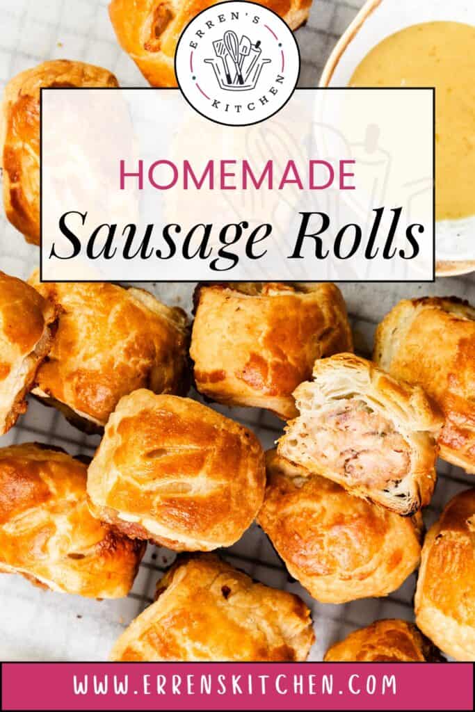 Golden and flaky, a batch of homemade sausage rolls rests on a cooling rack. One roll is split open, revealing its savory sausage filling. A bowl of dipping sauce peeks from the top right corner. Discover more at www.errenskitchen.com.