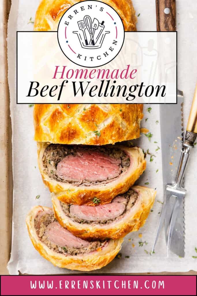 Sliced Beef Wellington graces a parchment-lined tray, revealing its delightful layers of puff pastry and tender beef. Beside it, a knife and fork await. The text reads "Erren's Kitchen Homemade Beef Wellington" accompanied by a website URL.