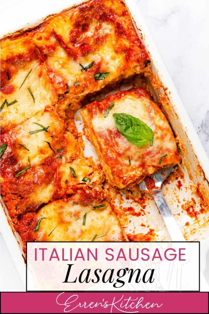 A baking dish with cheesy Italian sausage lasagna, topped with melted cheese and fresh basil leaves. One slice is being served with a spatula. Text: "Italian Sausage Lasagna, Erren's Kitchen.