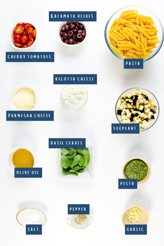 A top view showcases labeled ingredients for a ricotta pesto pasta dish, including Kalamata olives, cherry tomatoes, pasta, ricotta cheese, Parmesan cheese, eggplant, basil leaves, olive oil, salt, pepper, and garlic.