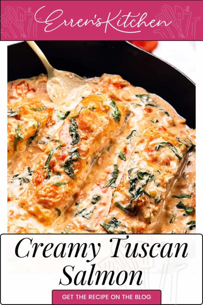 Creamy Tuscan salmon, lavishly topped with spinach and tomatoes, sizzles in a skillet. A spoon hints at the perfect serving. "Erren's Kitchen" crowns the top, while "Creamy Tuscan Salmon" invites you to get the recipe on the blog.