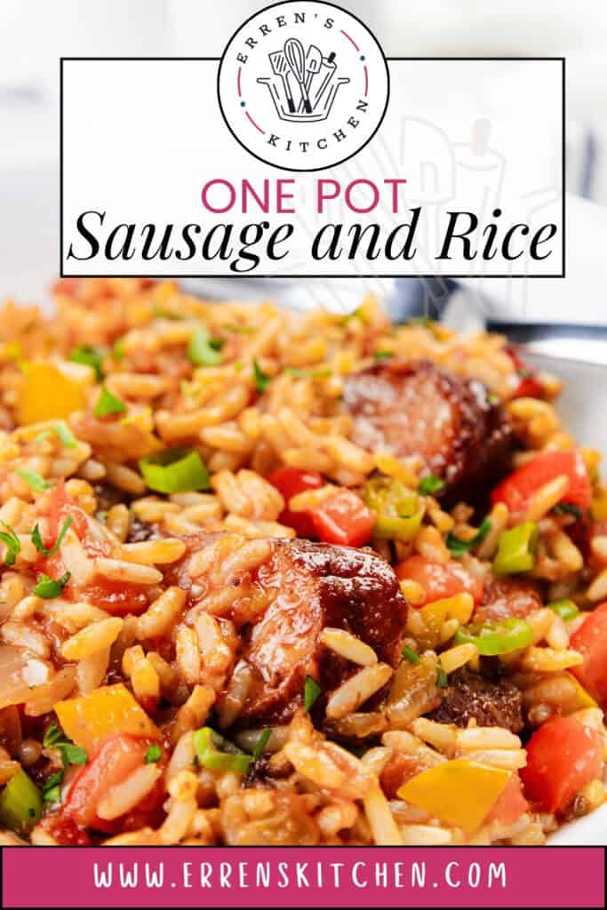 A close-up of a vibrant sausage and rice dish brimming with colorful bell peppers and herbs in a savory sauce. Above, "One Pot Sausage and Rice" shines, inviting you to explore more through a website link at the bottom.