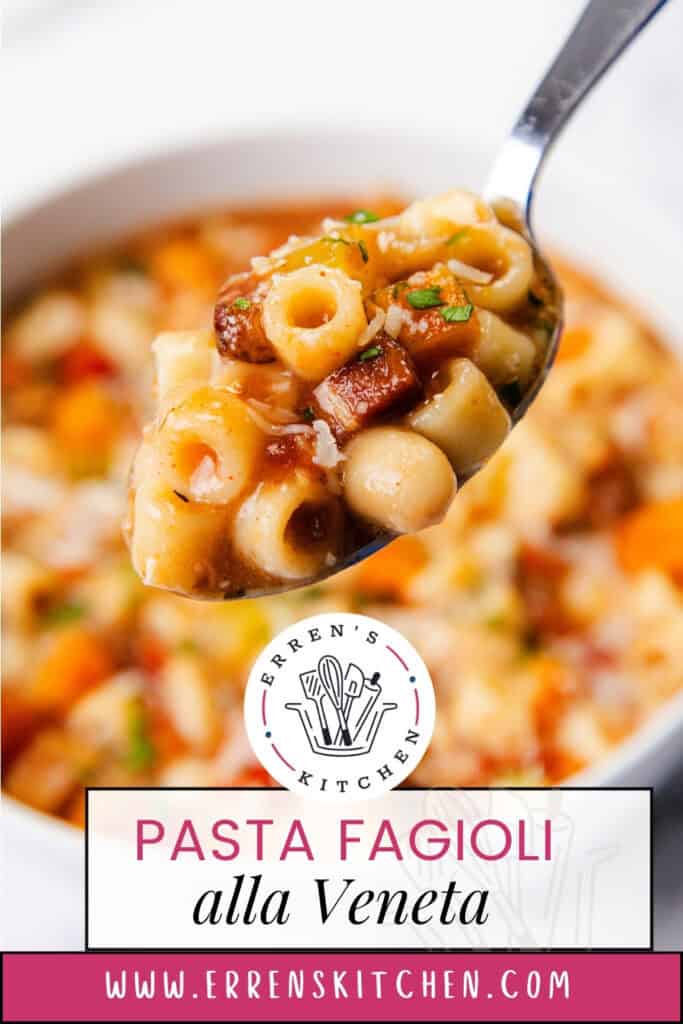 A close-up of a spoonful of Pasta Fagioli, a staple in Italian cuisine, with diced tomatoes, beans, and herbs. The background reveals a bowl filled with this Veneta delight. Text reads: "Pasta Fagioli alla Veneta" with a website URL at the bottom.